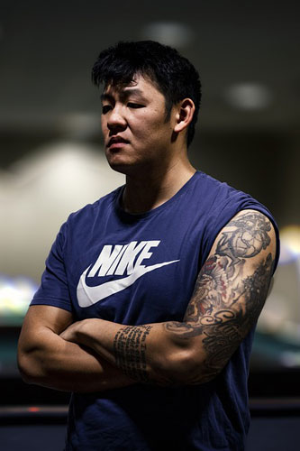 Visible tattoos.