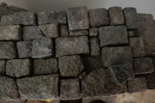 Little papier-mache bricks.