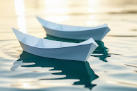 Like origami boats in the water.